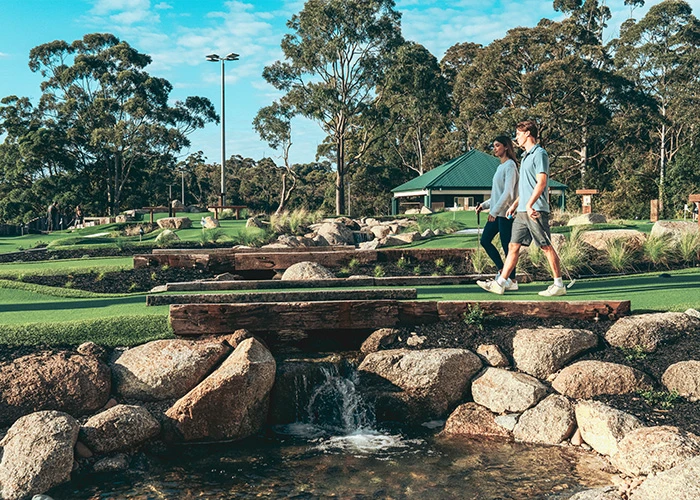 Couple walking in a golf course